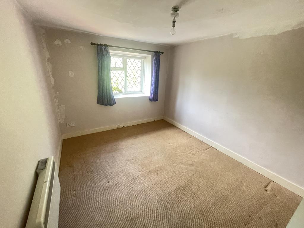 Lot: 156 - END-TERRACE COTTAGE FOR IMPROVEMENT - Bedroom with carpet and painted walls